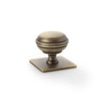 Alexander & Wilks Quantock Cupboard Knob on Square Backplate - Antique Brass - 34mm