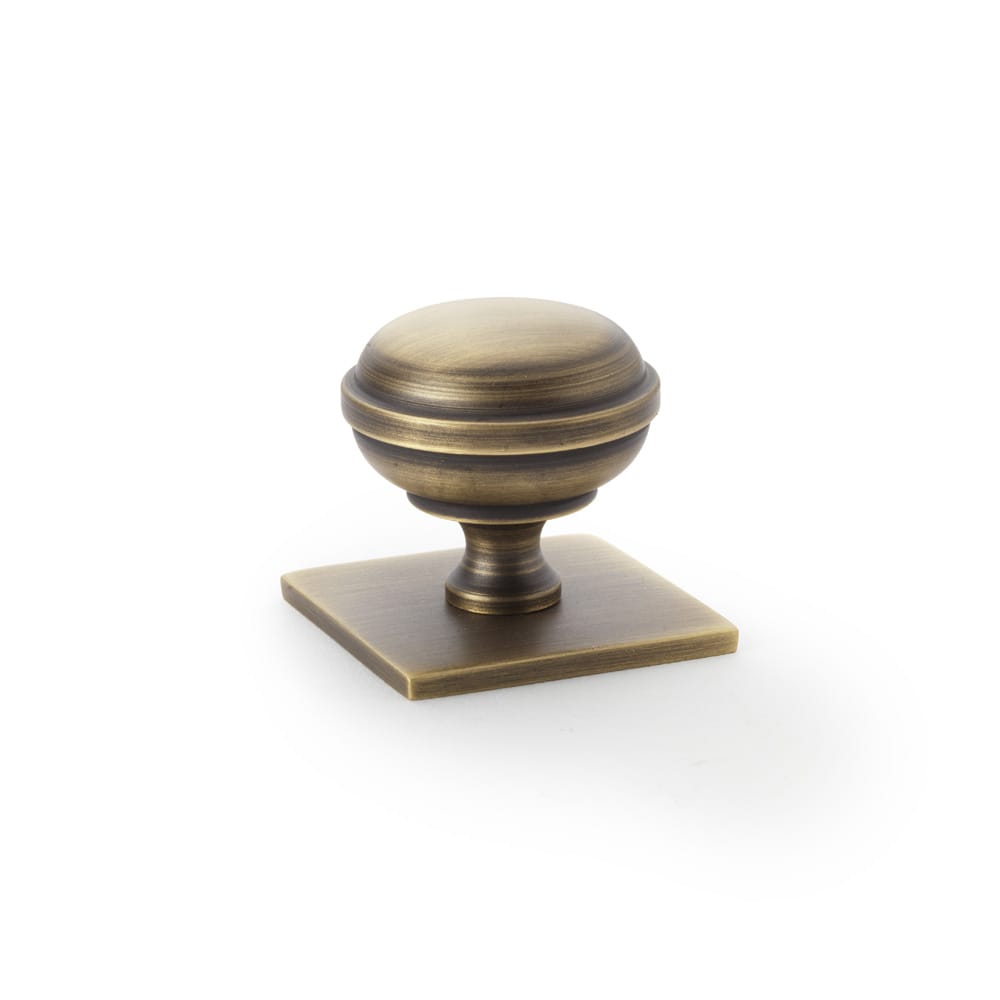 aw826-34-ab.jpg Alexander & Wilks Quantock Cupboard Knob on Square Backplate - Antique Brass - 34mm - Image 1