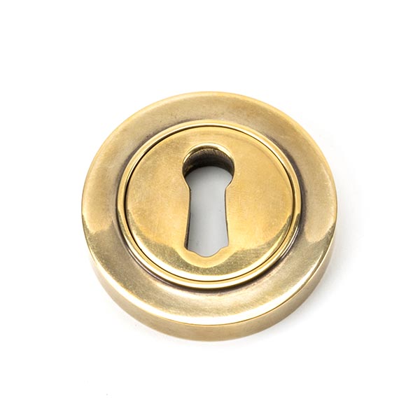 From the Anvil Aged Brass Round Escutcheon (Plain)