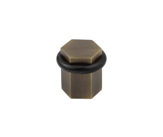 bur965ab.jpg Frelan Burlington Hexagonal Floor Mounted Doorstops Antique Brass - Image 1