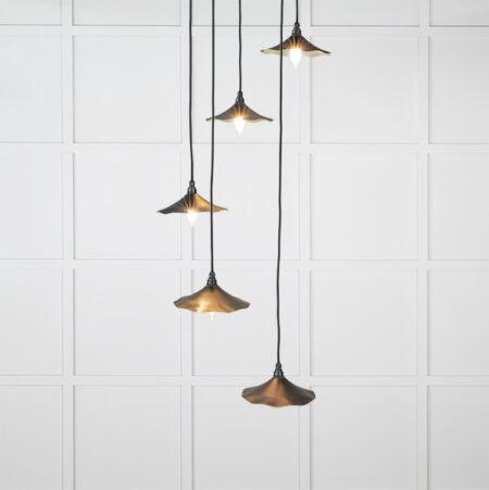 From the Anvil Smooth Brass Flora Cluster Pendant in Elan Black