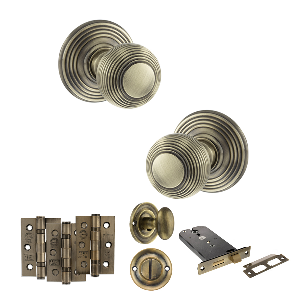 ADPOE50RMKAB70_OLD-ENGLISH-RIPON-ANTIQUE-BRASS.jpg Atlantic Old English Ripon Door Knob Pack (Lock Set - Horizontal Bathlock, 3" Fire Rated Hinges x3) - Antique Brass - Image 1