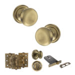 Atlantic Old English Harrogate Door Knob Pack (Lock Set - Horizontal Bathlock, 3" Fire Rated Hinges x3) - Antique Brass
