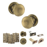 Atlantic Old English Harrogate Door Knob Pack (Bathroom Set - 4" Deadbolt, 4" Fire Rated Hinges x3) - Matt Antique Brass