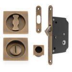 Alexander & Wilks Sliding Door Lock Set - Square Roses - Radius Forend & Strike - Antique Brass